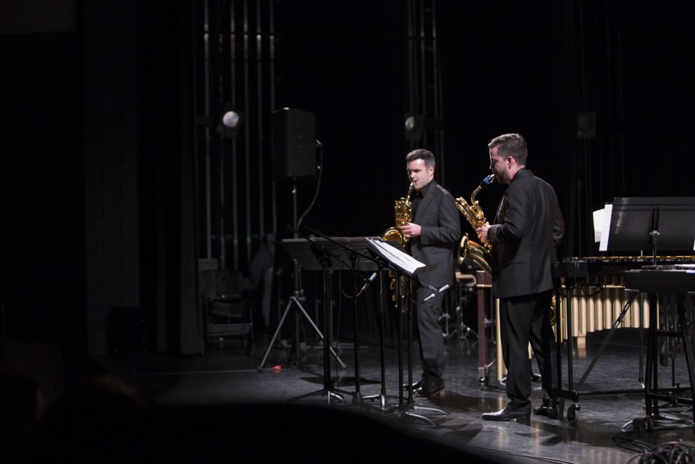 GVL / Sara Carte - Jonathan Nichol (left) and Geoffrey Deibel (right) perform at the GVSU New Music Ensemble 10th Anniversary Concert to begin at the Peter Martin Wege Theatre in Grand Rapids on Saturday, Apr. 2, 2016.