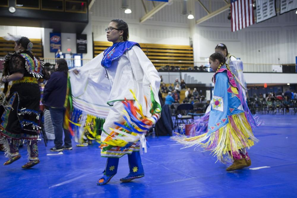 GVL / Sara Carte - Native American dancers dance in the Native American Pow-Wow in the Fieldhouse on Saturday, Apr. 9, 2016.