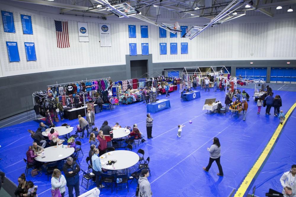 GVL / Sara Carte - Vendors sell specialized items at the Native American Pow-Wow in the Fieldhouse on Saturday, Apr. 9, 2016.