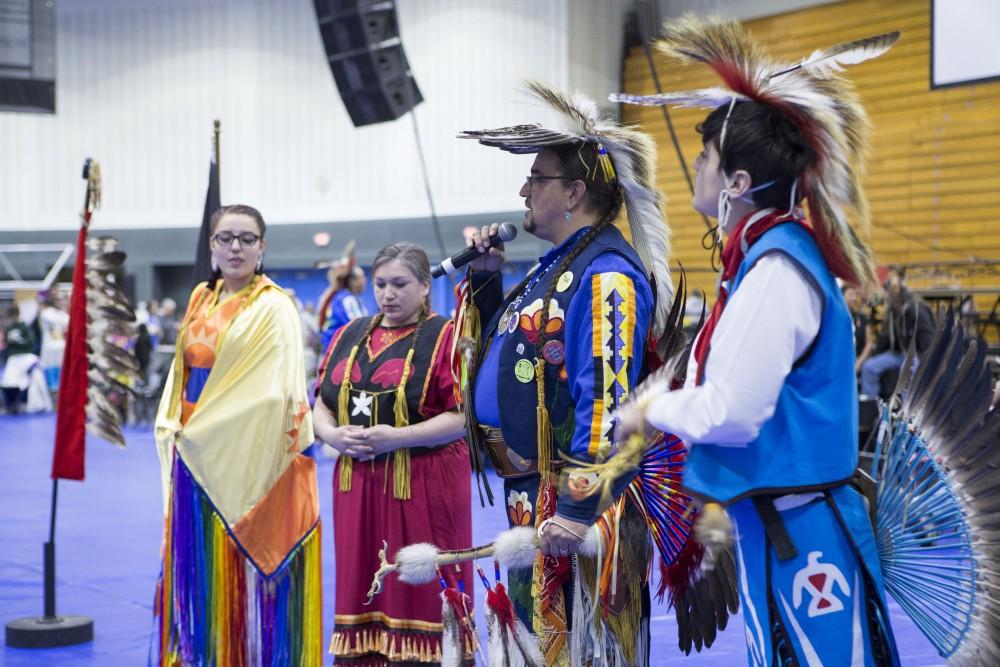 GVL / Sara Carte - The head dancers speak at the Native American Pow-Wow in the Fieldhouse on Saturday, Apr. 9, 2016.