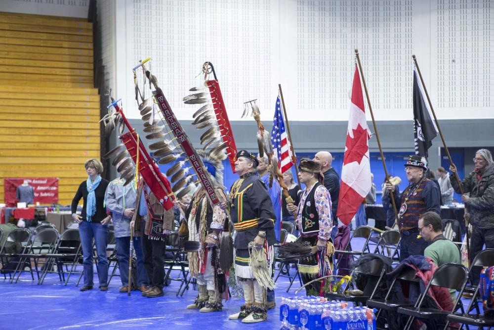 GVL / Sara Carte - Native American dancers start the Pow-Wow at the Native American Pow-Wow in the Fieldhouse on Saturday, Apr. 9, 2016.