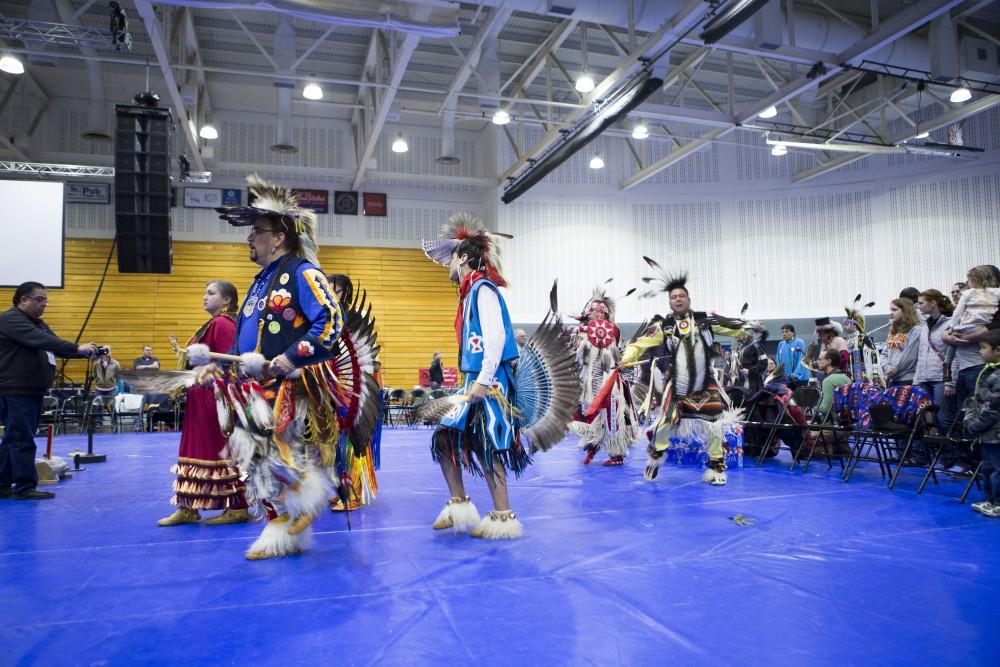 GVL / Sara Carte - Native American dancers dance in the Native American Pow-Wow in the Fieldhouse on Saturday, Apr. 9, 2016.