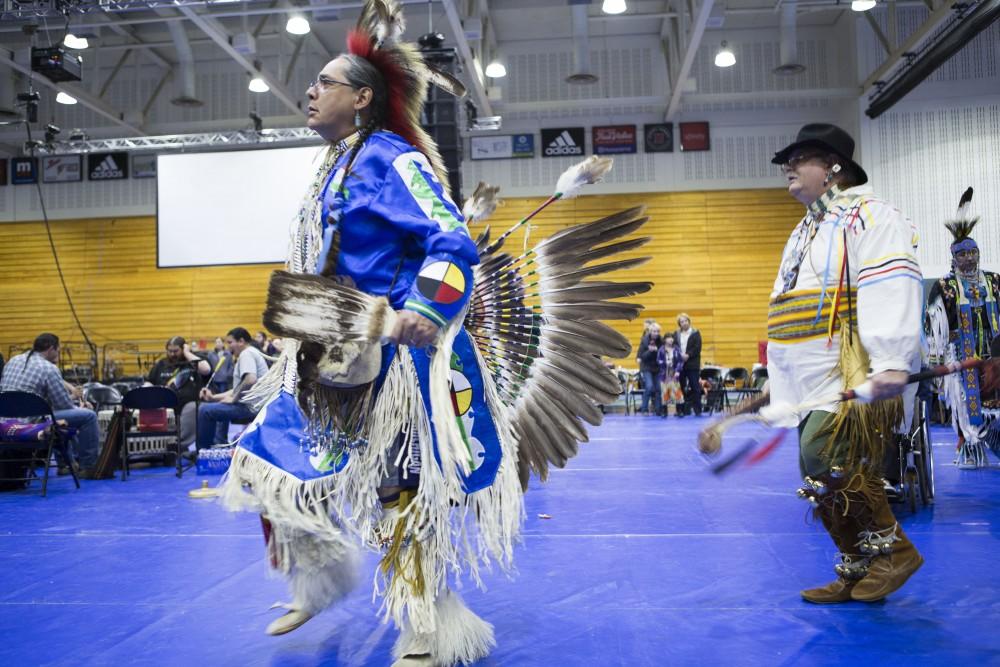 GVL / Sara Carte - Native American dancers dance in the Native American Pow-Wow in the Fieldhouse on Saturday, Apr. 9, 2016.