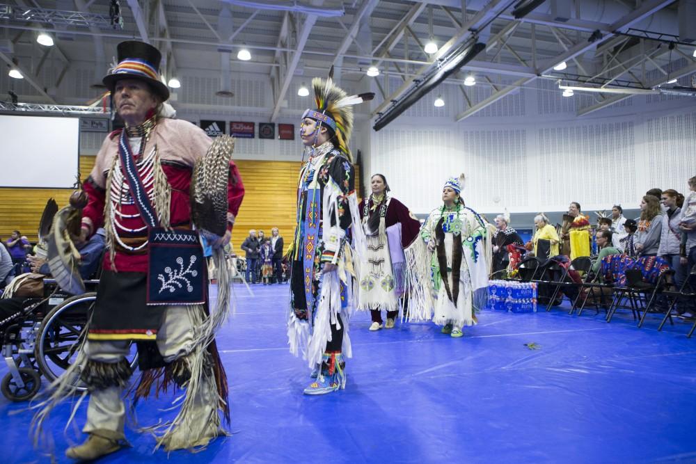 GVL / Sara Carte - Native American dancers dance in the Native American Pow-Wow in the Fieldhouse on Saturday, Apr. 9, 2016.