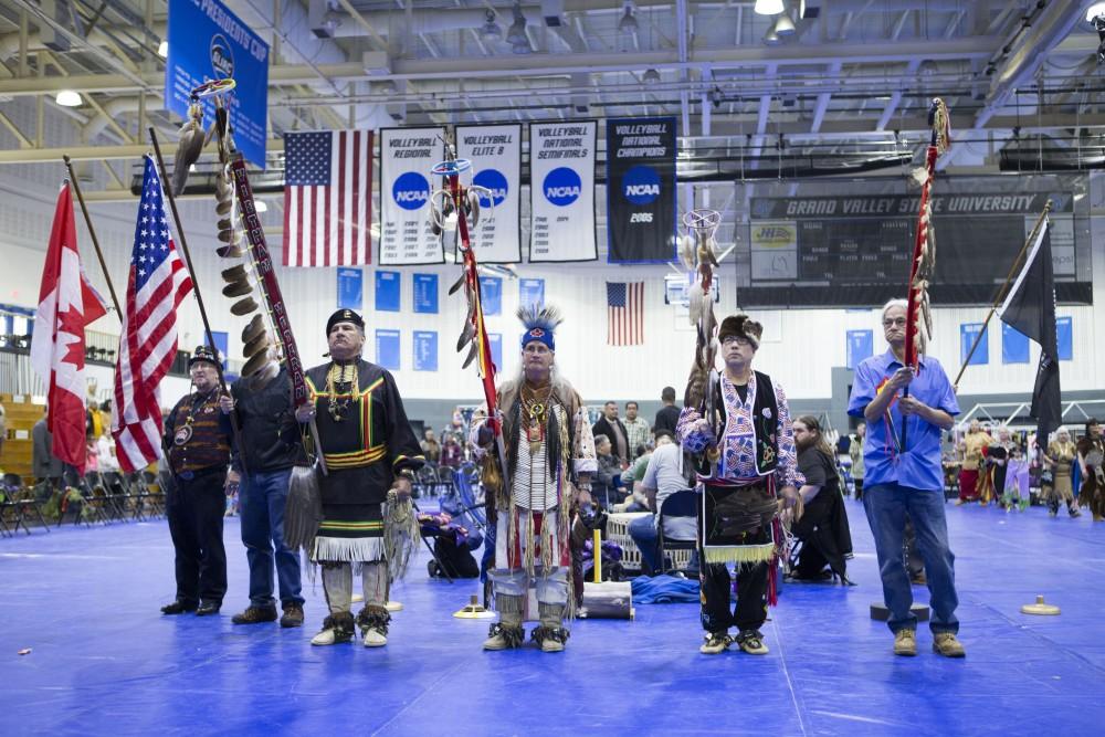 GVL / Sara Carte - Native American veterans carry all significant flags at the Native American Pow-Wow in the Fieldhouse on Saturday, Apr. 9, 2016.