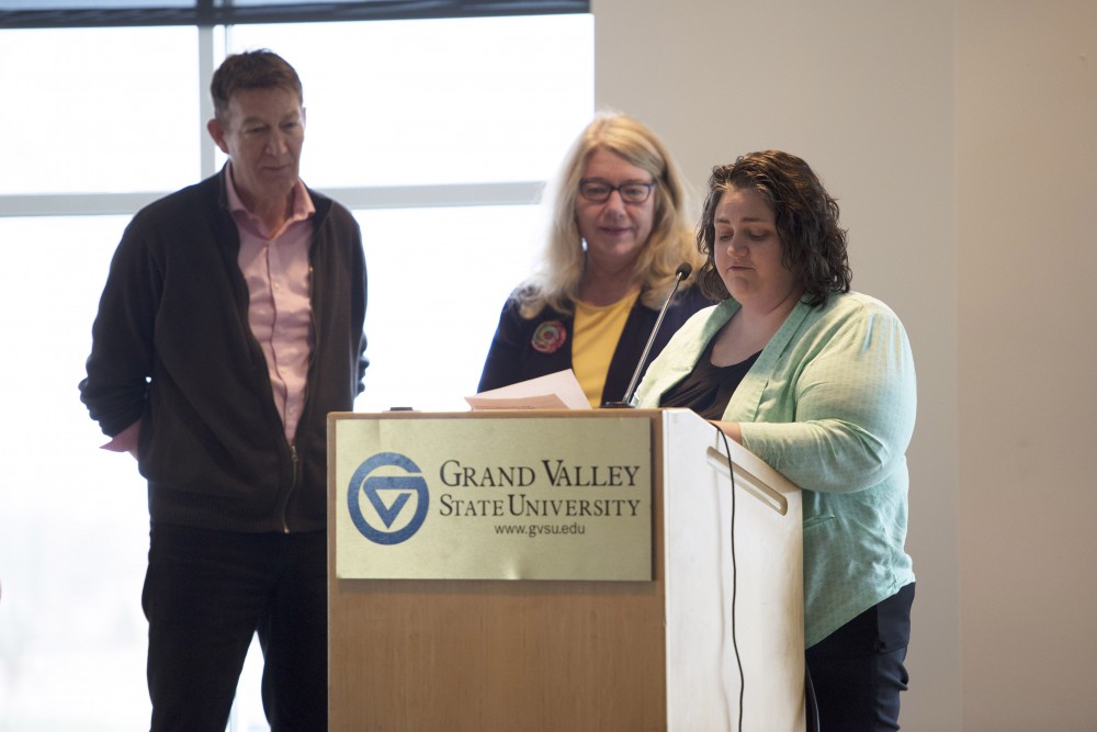 GVL / Luke Holmes- Carrie Simmons gives the Service to the Community award to Monica Johnstone and Gary Van Harn. The Pride Awards were held in the Kirkhof Center Wednesday, Mar. 30, 2016, to honor those who have made a positive impact on the LGBT community at GVSU.