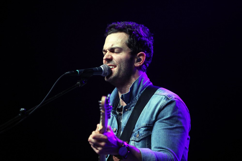 GVL / Emily Frye 
Warner Nashville Music artist Ryan Kinder hits the stage at Grand Valley State University on Thursday April 7, 2016. 