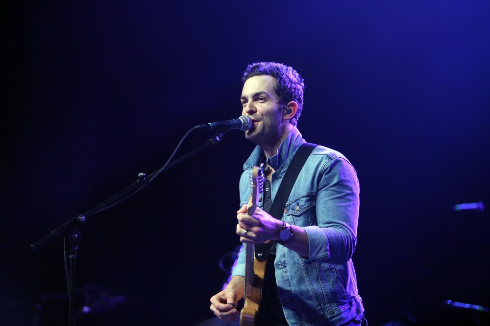 GVL / Emily Frye 
Warner Nashville Music artist Ryan Kinder hits the stage at Grand Valley State University on Thursday April 7, 2016. 