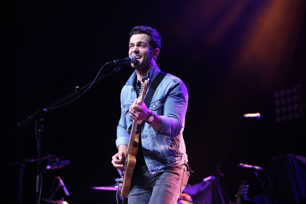 GVL / Emily Frye 
Warner Nashville Music artist Ryan Kinder hits the stage at Grand Valley State University on Thursday April 7, 2016. 