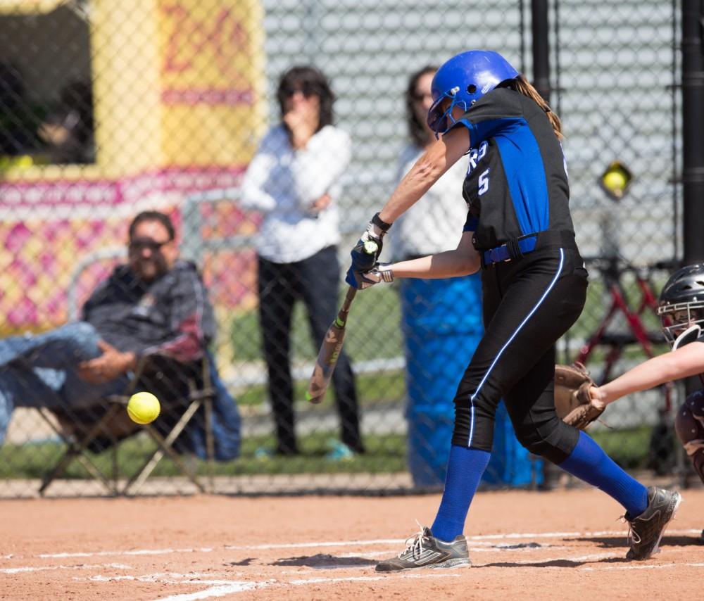 GVL / Kevin Sielaff – Chelsea Horvath (5) takes a swing at a low pitch and makes contact. Grand Valley takes the victory over Walsh in both games held in Allendale on Saturday, April 23, 2016.