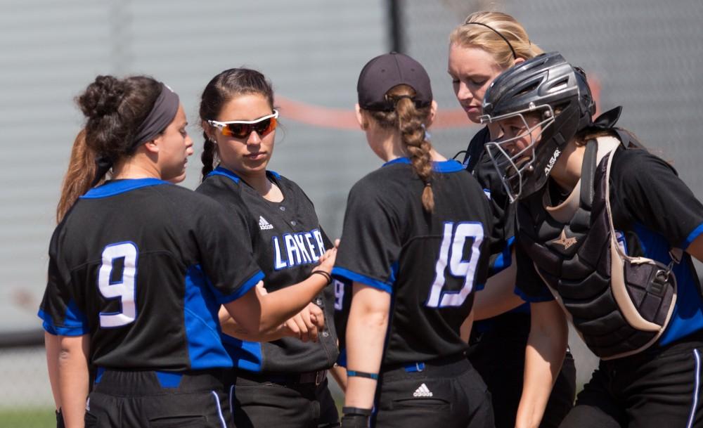 GVL / Kevin Sielaff – McKenze Supernaw (3) huddles with her teammates. Grand Valley takes the victory over Walsh in both games held in Allendale on Saturday, April 23, 2016.