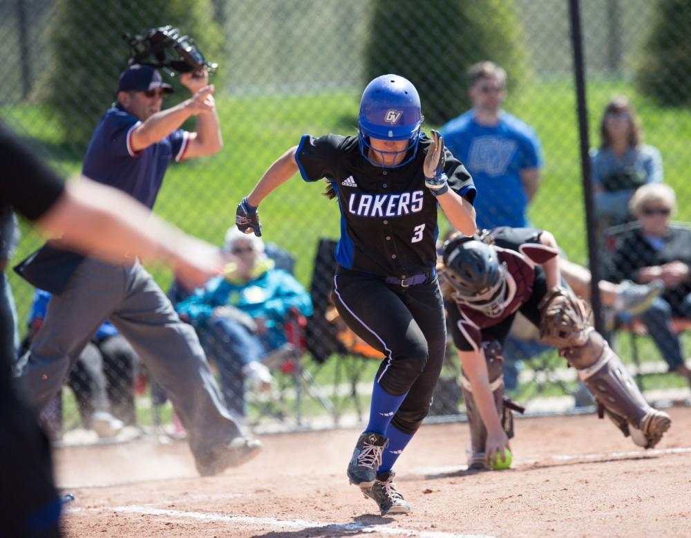 GVL / Kevin Sielaff – McKenze Supernaw (3) bunts the ball and is thrown out at first base. Grand Valley takes the victory over Walsh in both games held in Allendale on Saturday, April 23, 2016.