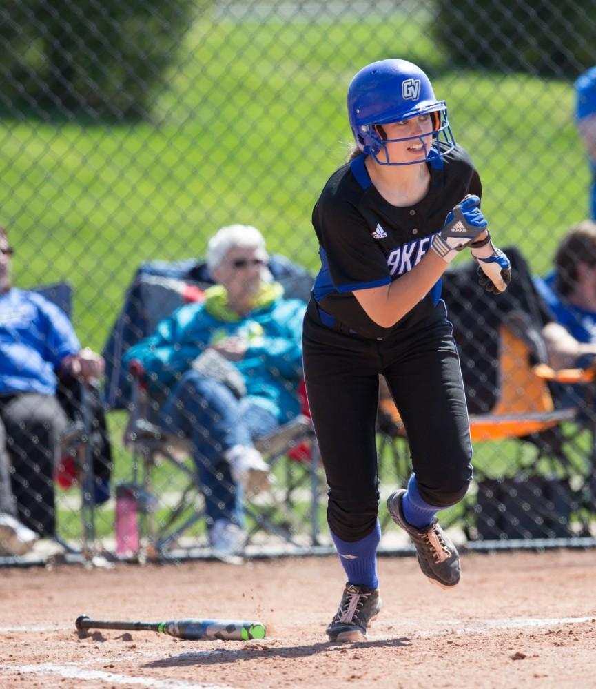 GVL / Kevin Sielaff – Shannon Flaherty (19) watches her base hit fly into the outfield. Grand Valley takes the victory over Walsh in both games held in Allendale on Saturday, April 23, 2016.