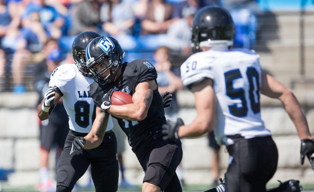 GVL / Kevin Sielaff - Nick Dodson (11) receives a pass and runs upfield. The 2016 Grand Valley State Spring Classic is hosted at Lubbers Stadium on Saturday, April 16, 2016.