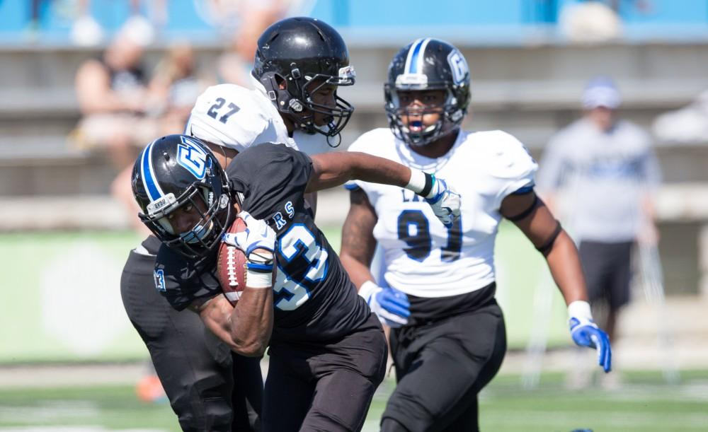 GVL / Kevin Sielaff - Christian Lumpkin (33) takes a handoff and charges upfield. The 2016 Grand Valley State Spring Classic is hosted at Lubbers Stadium on Saturday, April 16, 2016.