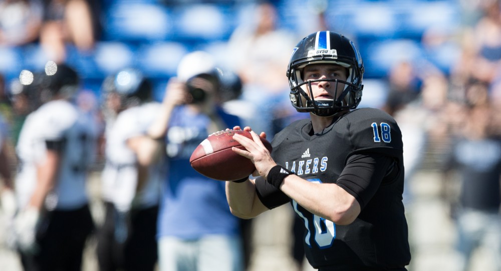 GVL / Kevin Sielaff - Ollie Ajami (18) looks to throw the ball downfield during warm-ups. The 2016 Grand Valley State Spring Classic is hosted at Lubbers Stadium on Saturday, April 16, 2016.