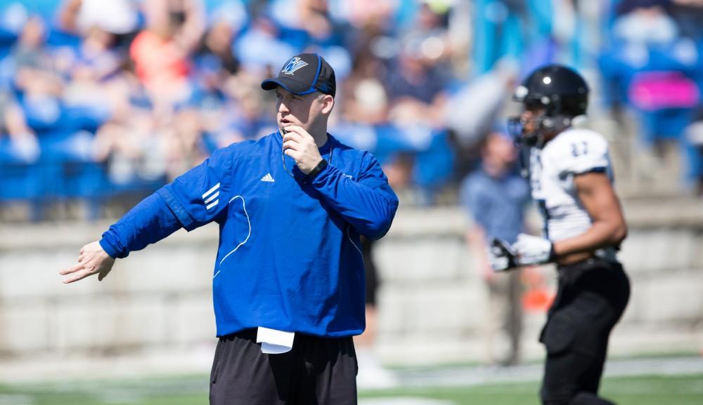 GVL / Kevin Sielaff - Co-defensive coordinator Nick Postma organizes various drills on the sideline in between scrimmages. The 2016 Grand Valley State Spring Classic is hosted at Lubbers Stadium on Saturday, April 16, 2016.