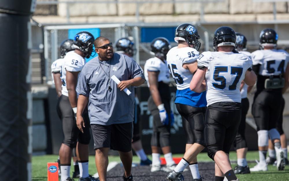 GVL / Kevin Sielaff - E.J. Whitlow, defensive line coach, works his linemen on the sideline. The 2016 Grand Valley State Spring Classic is hosted at Lubbers Stadium on Saturday, April 16, 2016.