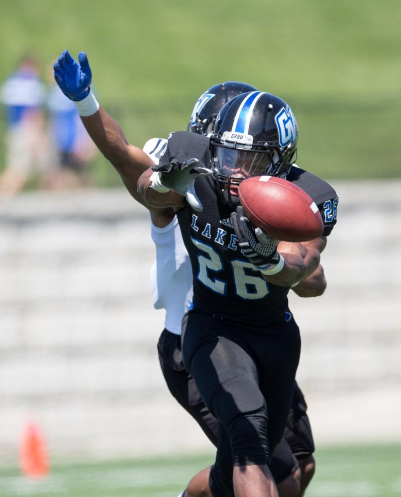 GVL / Kevin Sielaff - Jalen Bryant (26) reaches to receive a pass but has it blocked. The 2016 Grand Valley State Spring Classic is hosted at Lubbers Stadium on Saturday, April 16, 2016.