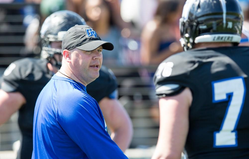 GVL / Kevin Sielaff - Tim Morrison, offensive coordinator, runs his linemen through drills on the sideline. The 2016 Grand Valley State Spring Classic is hosted at Lubbers Stadium on Saturday, April 16, 2016.