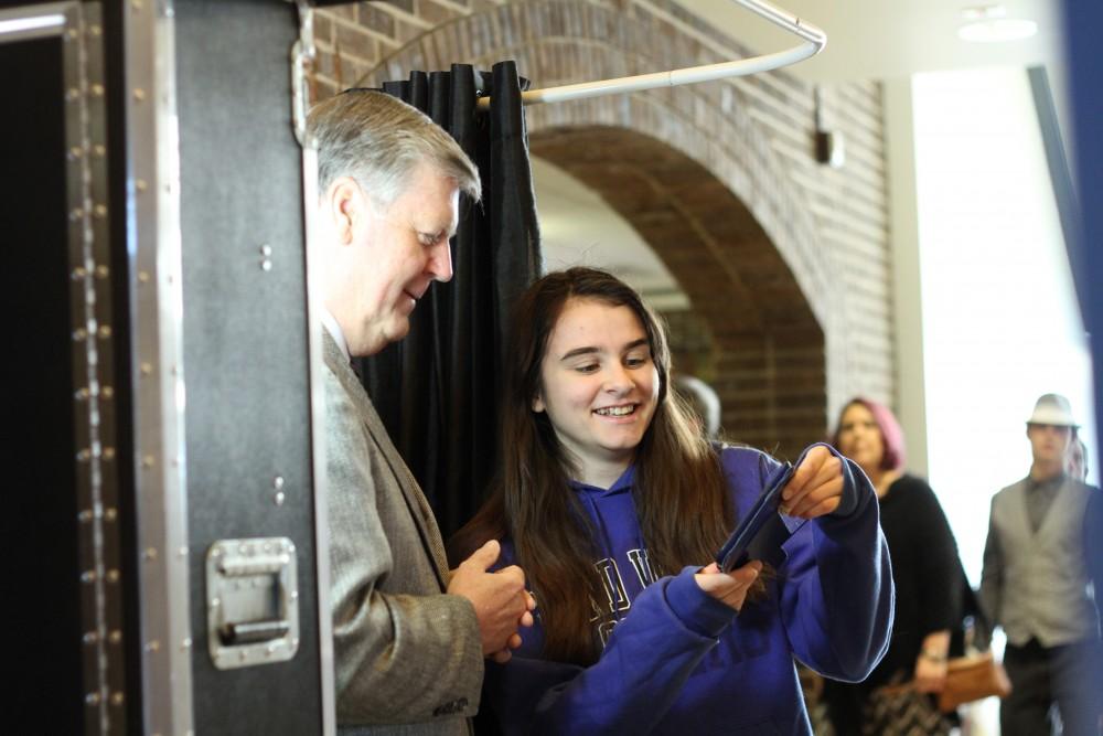 GVL / Kasey Garvelink - While helping out at a Student Life event, President T. Haas has fun taking pictures with a student in a photo booth on Apr. 1, 2016 in Allendale. 
