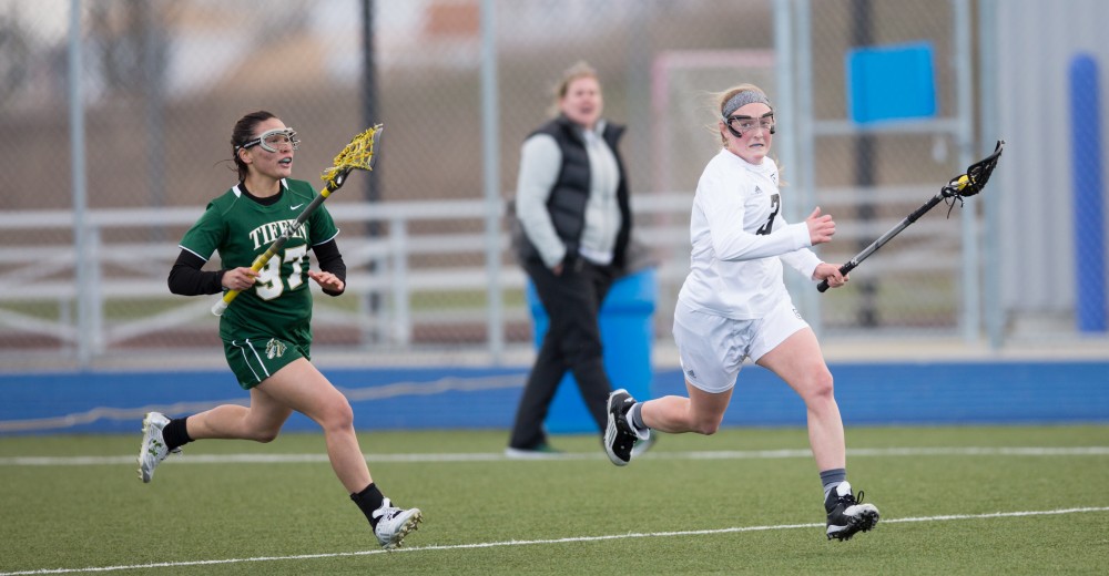 GVL / Kevin Sielaff – Erika Neumen (3) races up field and into Tiffin's zone. The Lakers take the victory over Tiffin University Friday, April 1, 2016.