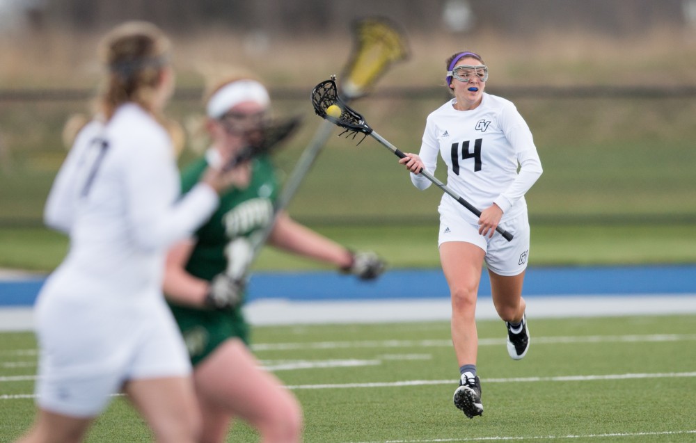 GVL / Kevin Sielaff – Chloe Zdybel (14) clears the ball out of the Lakers zone and throws it up field. The Lakers take the victory over Tiffin University Friday, April 1, 2016.