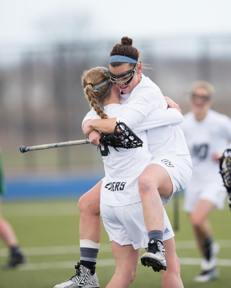 GVL / Kevin Sielaff – Carolyn Kraus (23) and Erika Neumen (3) celebrate a goal. The Lakers take the victory over Tiffin University Friday, April 1, 2016.