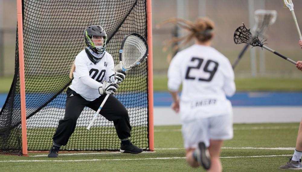 GVL / Kevin Sielaff – Sarah Zwilsky (00) gets ready to block an incoming Tiffin shot. The Lakers take the victory over Tiffin University Friday, April 1, 2016.