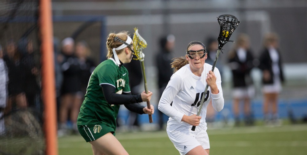 GVL / Kevin Sielaff – Meghan Datema (18) moves in on Tiffin's net and draws a penalty. The Lakers take the victory over Tiffin University Friday, April 1, 2016.