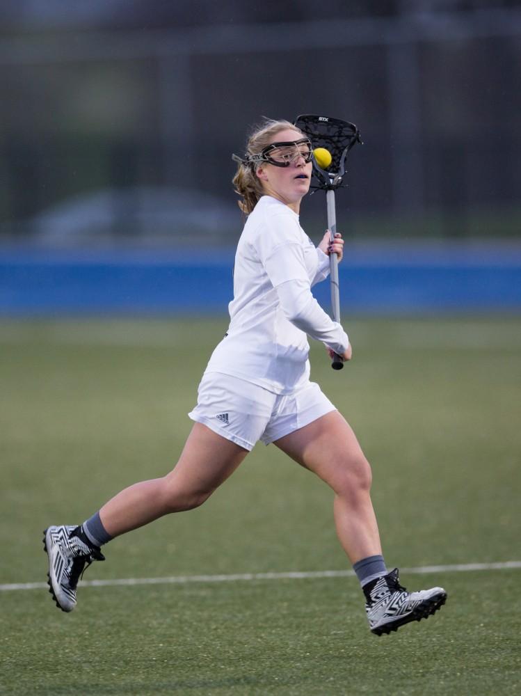 GVL / Kevin Sielaff – Kelly Leibovitz (5) holds the ball at the top of Tiffin's zone. The Lakers take the victory over Tiffin University Friday, April 1, 2016.