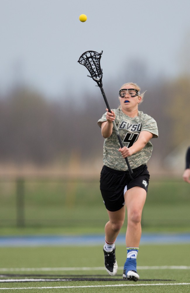 GVL / Kevin Sielaff - Kira Dosenberry (4) throws a pass up field. Grand Valley defeats Lake Erie College with a final score of 19-2 on Friday, April 29, 2016 in Allendale. 