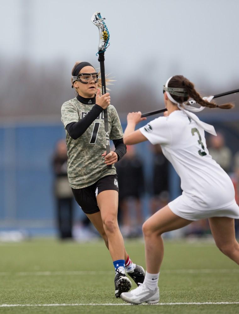 GVL / Kevin Sielaff - Ryan Skomial (1) works her way through Lake Erie's defense. Grand Valley defeats Lake Erie College with a final score of 19-2 on Friday, April 29, 2016 in Allendale. 