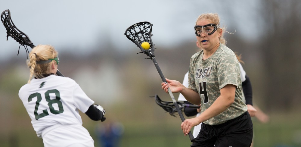 GVL / Kevin Sielaff - Kira Dosenberry (4) moves the ball in Lake Erie's zone. Grand Valley defeats Lake Erie College with a final score of 19-2 on Friday, April 29, 2016 in Allendale. 