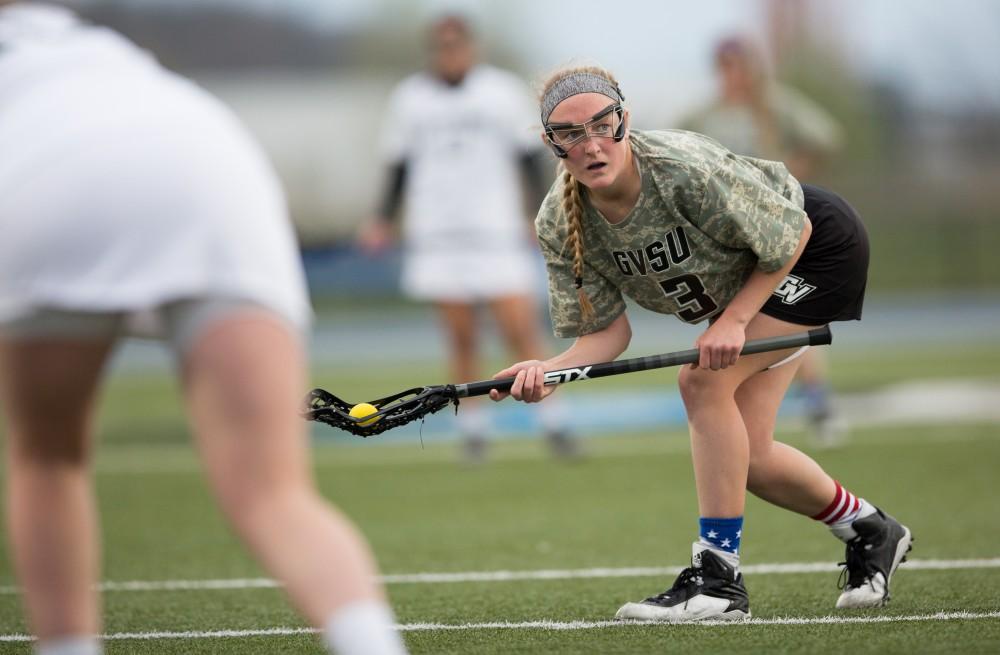 GVL / Kevin Sielaff - Erika Neumen (3) sets up for a free position shot. Grand Valley defeats Lake Erie College with a final score of 19-2 on Friday, April 29, 2016 in Allendale. 