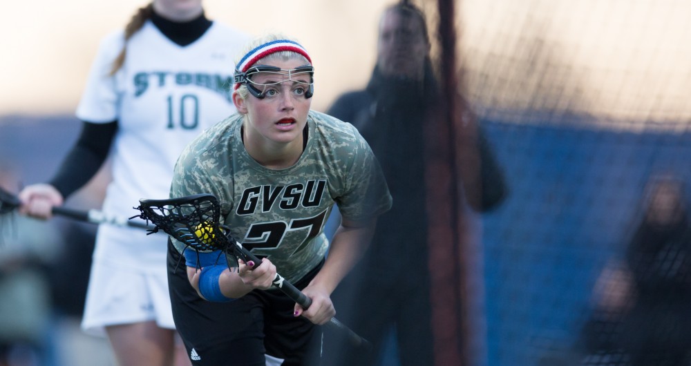 GVL / Kevin Sielaff - Danielle Tunnell (27) sets up for a free position shot. Grand Valley defeats Lake Erie College with a final score of 19-2 on Friday, April 29, 2016 in Allendale. 