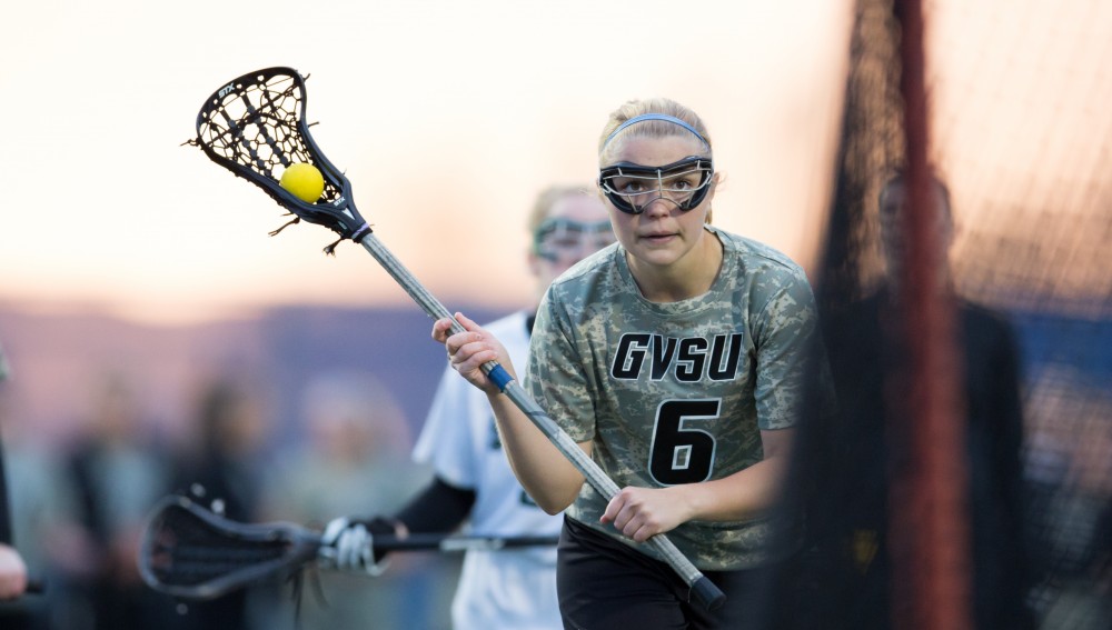 GVL / Kevin Sielaff - Ashley Bailey (6) sets up for a free position shot. Grand Valley defeats Lake Erie College with a final score of 19-2 on Friday, April 29, 2016 in Allendale. 