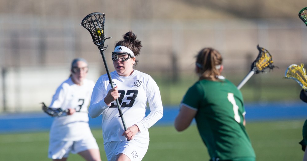 GVL / Kevin Sielaff – Caitlin Wojichowski (33) carries the ball up field. The Lakers take the victory over Tiffin University Friday, April 1, 2016.