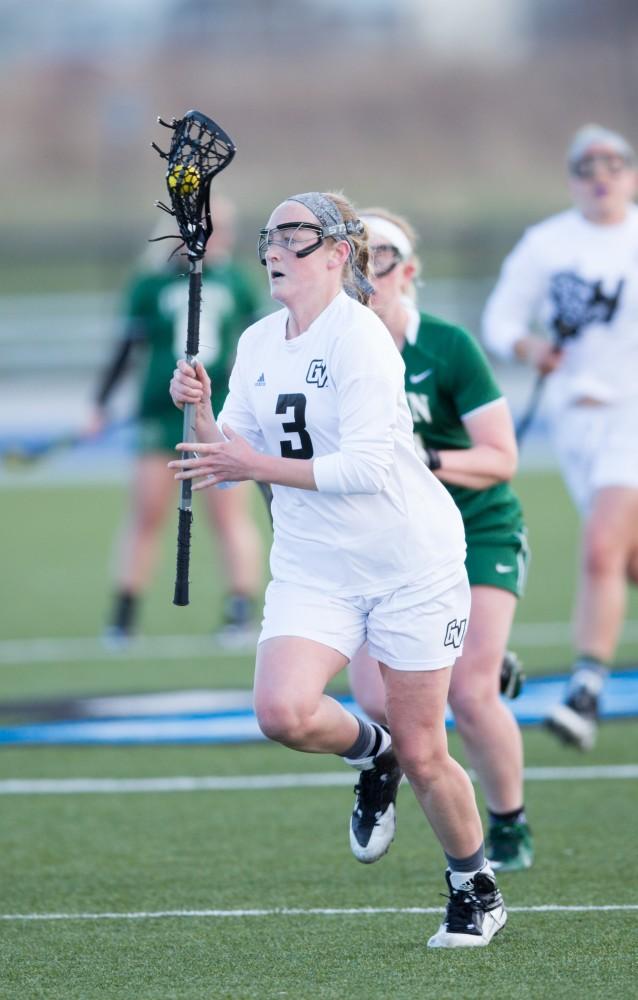 GVL / Kevin Sielaff – Erika Neumen (3) carries the ball up and into Tiffin's zone. The Lakers take the victory over Tiffin University Friday, April 1, 2016.