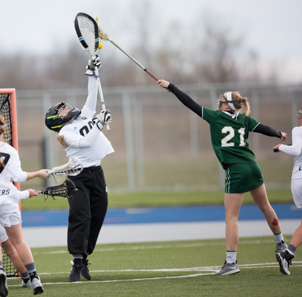 GVL / Kevin Sielaff – Sarah Zwilsky (00) denies the shot on goal and clears the zone. The Lakers take the victory over Tiffin University Friday, April 1, 2016.