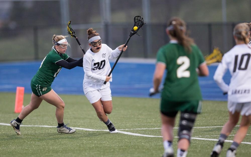 GVL / Kevin Sielaff – Winnie Bohls (30) tip-toes on the sideline, but is pushed out of bounds. The Lakers take the victory over Tiffin University Friday, April 1, 2016.