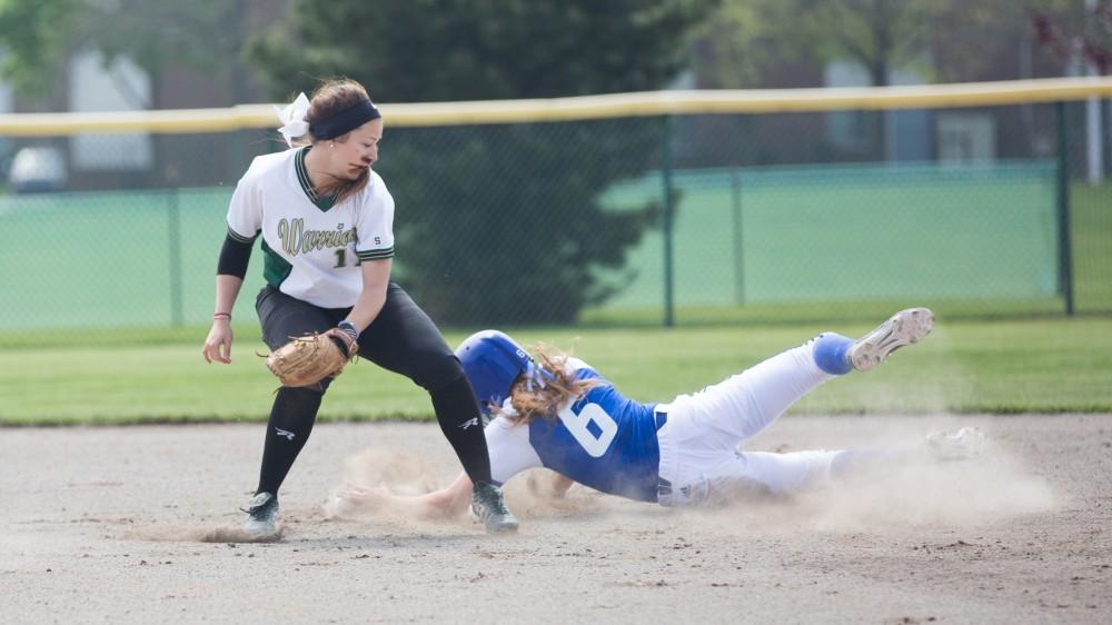 GVL / Kevin Sielaff - Catcher Kaylie Rhynard (6) successfully steals second base. Grand Valley State squares off against Wayne State in the second game of the Midwest Super Regional tournament. The Lakers came out with the victory with a final score of 1-0 on Thursday, May 12, 2016 in Detroit, MI. 