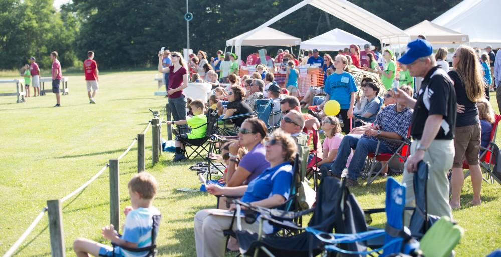 GVL / Kevin Sielaff - Students of STEPS (Science, Technology, and Engineering Day Camps) fly planes that they have built during camp at Warped Wings Fly Field in Allendale on Thursday, June 23, 2016. 