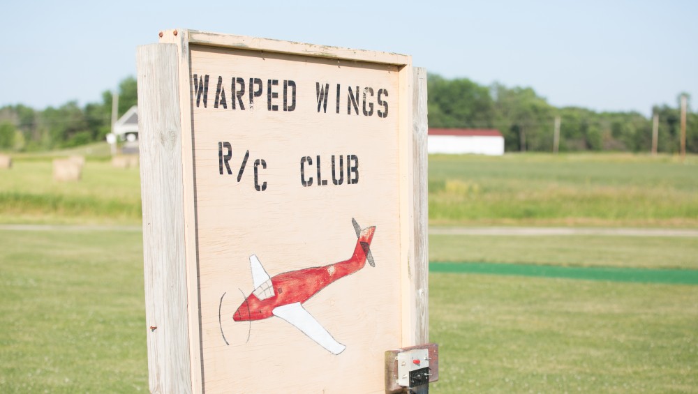 GVL / Kevin Sielaff - Students of STEPS (Science, Technology, and Engineering Day Camps) fly planes that they have built during camp at Warped Wings Fly Field in Allendale on Thursday, June 23, 2016. 