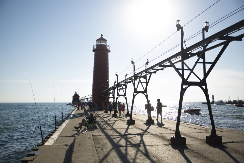 GVL / Luke Holmes - Grand Haven attracts many locals and visitors on a warm, sunny day.