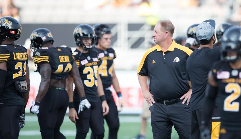 GVL/Kevin Sielaff - The Tiger-Cats' coaching staff helps facilitate on-field drills before the start of the match. The Hamilton Tiger-Cats square off against the Saskatchewan Roughriders Saturday, August 20, 2016 in Hamilton, Ontario. 