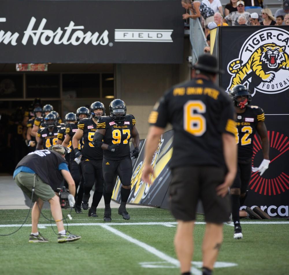 GVL/Kevin Sielaff - The Tiger-Cats take the field. The Hamilton Tiger-Cats square off against the Saskatchewan Roughriders Saturday, August 20, 2016 in Hamilton, Ontario. 