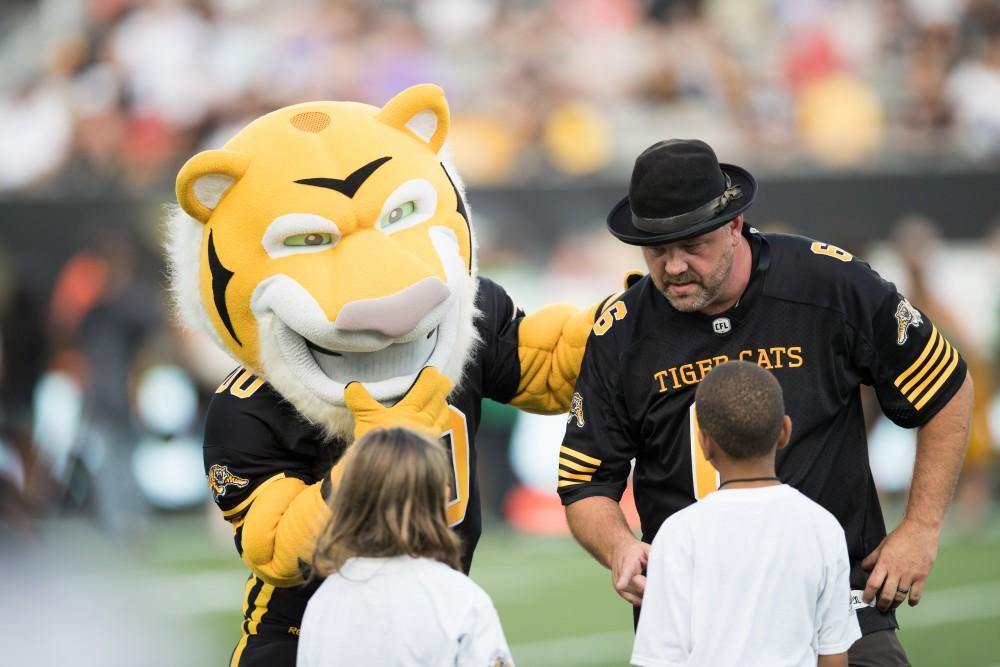 GVL/Kevin Sielaff - Pigskin Pete (right) and the Tiger-Cats' mascot (left) get the crowd excited before the match. The Hamilton Tiger-Cats square off against the Saskatchewan Roughriders Saturday, August 20, 2016 in Hamilton, Ontario. 