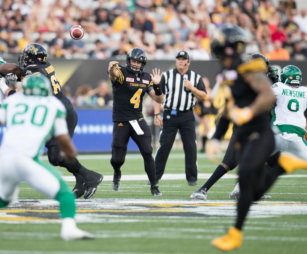 GVL/Kevin Sielaff - Zach Collaros (4) rockets a pass down field. The Hamilton Tiger-Cats square off against the Saskatchewan Roughriders Saturday, August 20, 2016 in Hamilton, Ontario. 