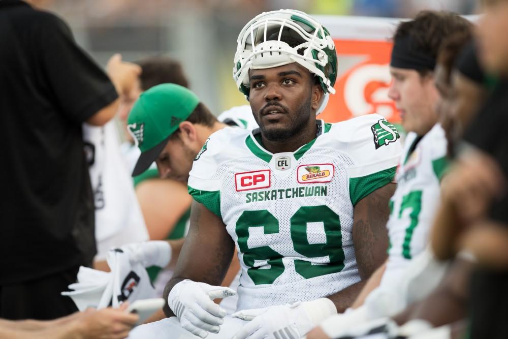 GVL/Kevin Sielaff - Kennedy Estelle (69) of the Roughriders listens to directions from the coaching staff. The Hamilton Tiger-Cats square off against the Saskatchewan Roughriders Saturday, August 20, 2016 in Hamilton, Ontario. 